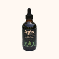 Bottle of Apis Apotheca Greensleeves All-Over Body Oil ✿ for Deep Hydration, Skin Barrier Support & Scalp Nourishment with dropper on a white background. Reusable, recyclable and refillable skincare ritual routine.