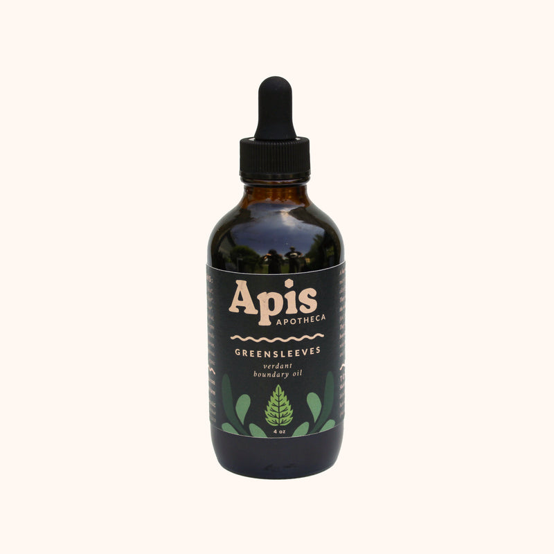 Bottle of Apis Apotheca Greensleeves All-Over Body Oil ✿ for Deep Hydration, Skin Barrier Support & Scalp Nourishment with dropper on a white background. Reusable, recyclable and refillable skincare ritual routine.