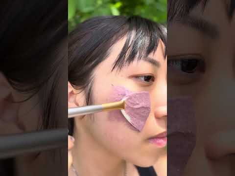 Person applying Apis Apotheca Bounce House Vitality Reboot Face Mask ❃ for Skin Renewal, Hydration & Collagen Support.